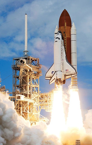  The Space Shuttle Discovery and its seven-member STS-120 crew head toward Earth-orbit and a scheduled link-up with the International Space Station. 